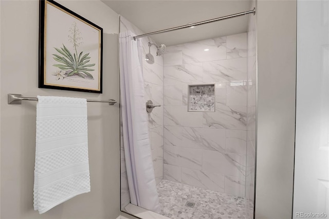 bathroom with a shower with shower curtain