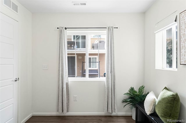 17767 E 54th Ave, Denver, CO 80249 - doorway to outside featuring wood finished floors, plenty of natural light, and baseboards