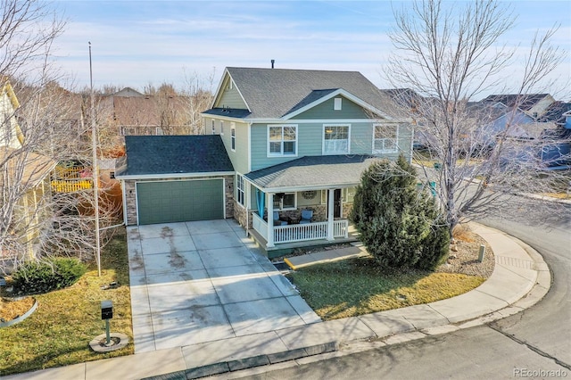 3406 Purcell St, Brighton, CO 80601 - view of front facade with covered porch, driveway, a garage, stone siding, and roof with shingles