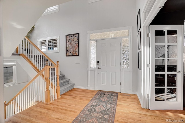 3406 Purcell St, Brighton, CO 80601 - entryway with wood finished floors, stairs, and baseboards