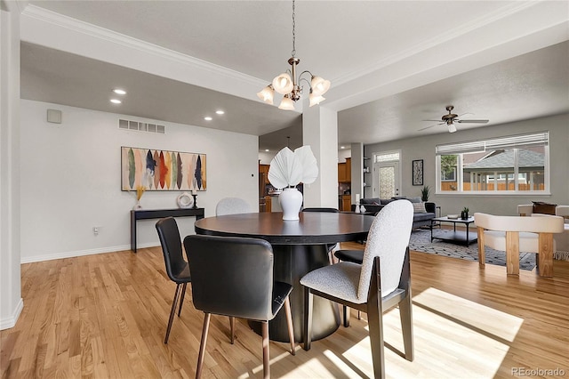 3406 Purcell St, Brighton, CO 80601 - dining area featuring light wood finished floors, crown molding, baseboards, a chandelier, and recessed lighting