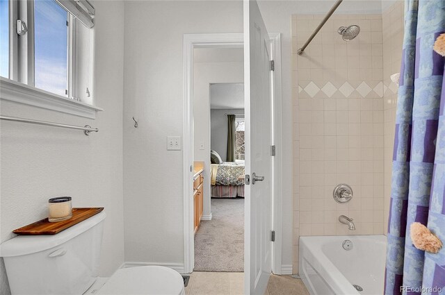 3406 Purcell St, Brighton, CO 80601 - bathroom with toilet, shower / bath combo, baseboards, and tile patterned flooring