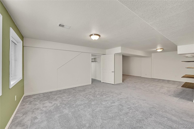 3406 Purcell St, Brighton, CO 80601 - finished basement with carpet floors, baseboards, and a textured ceiling