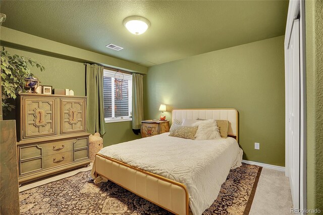 3406 Purcell St, Brighton, CO 80601 - carpeted bedroom with a textured ceiling and baseboards