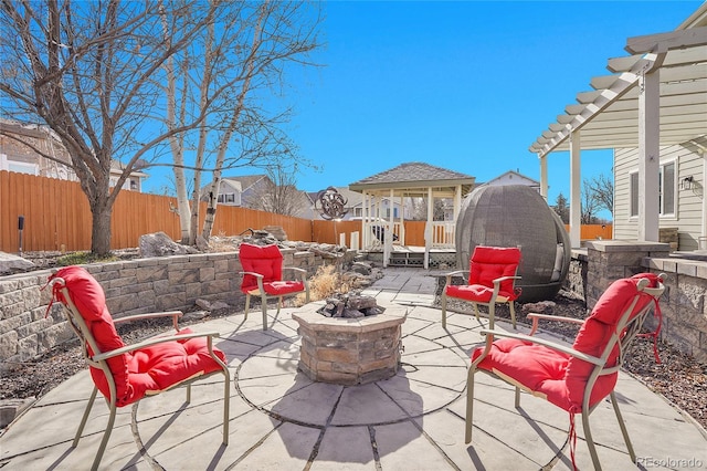 3406 Purcell St, Brighton, CO 80601 - view of patio / terrace with a fire pit and a fenced backyard