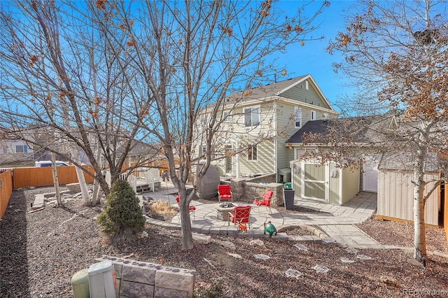 3406 Purcell St, Brighton, CO 80601 - back of house with a patio area, a fenced backyard, and an outdoor structure