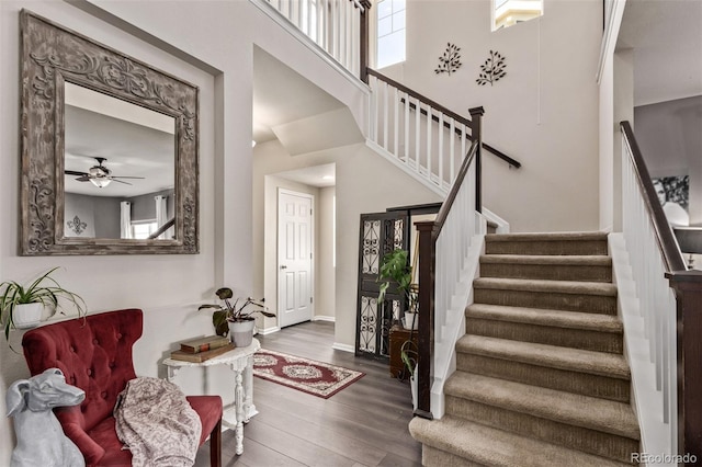 23757 Eagle Bend Ln, Parker, CO 80138 - entryway featuring wood finished floors, stairway, baseboards, and a ceiling fan