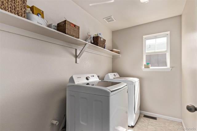 23757 Eagle Bend Ln, Parker, CO 80138 - laundry area with separate washer and dryer, baseboards, and light tile patterned floors