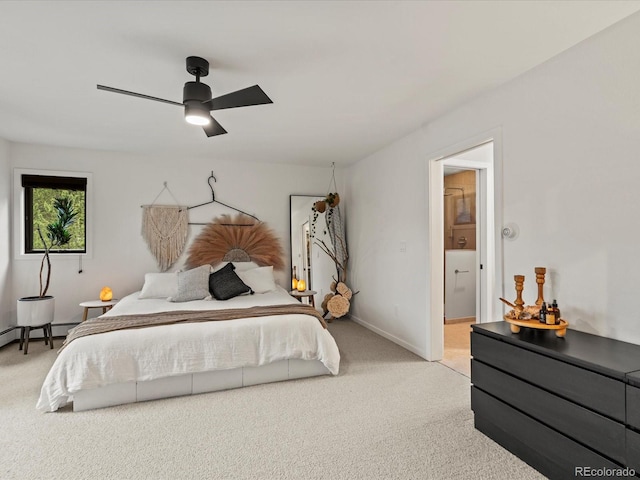 28833 Western Dr, Evergreen, CO 80439 - bedroom featuring light colored carpet, a baseboard radiator, a ceiling fan, and ensuite bathroom