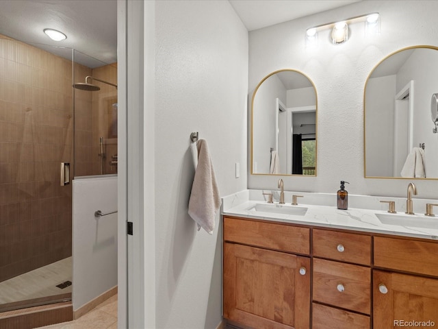 28833 Western Dr, Evergreen, CO 80439 - bathroom with a shower stall, double vanity, and tile patterned flooring