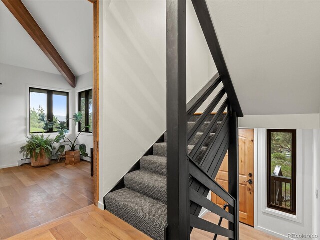 28833 Western Dr, Evergreen, CO 80439 - staircase with wood finished floors and healthy amount of natural light