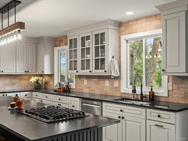 28833 Western Dr, Evergreen, CO 80439 - kitchen featuring appliances with stainless steel finishes, healthy amount of natural light, backsplash, a center island, and recessed lighting