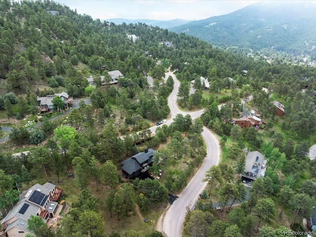 28833 Western Dr, Evergreen, CO 80439 - aerial overview of property's location featuring a heavily wooded area and mountains