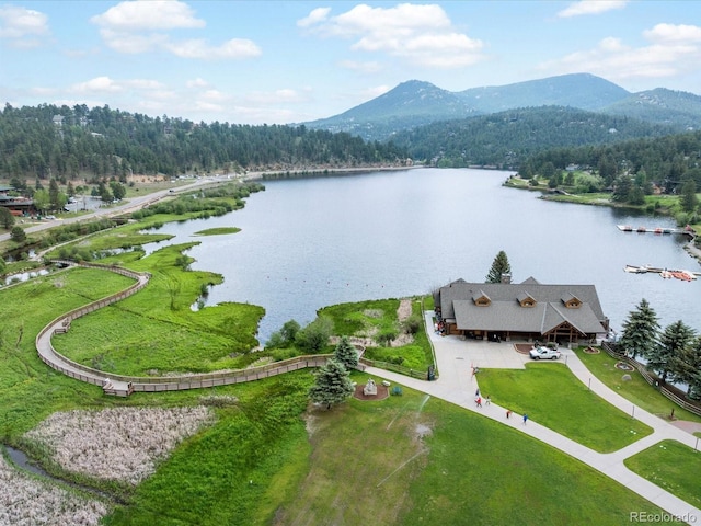 28833 Western Dr, Evergreen, CO 80439 - drone / aerial view of a water and mountain view and a heavily wooded area