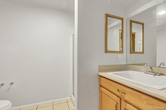 bathroom featuring vanity, an enclosed shower, tile patterned floors, and toilet