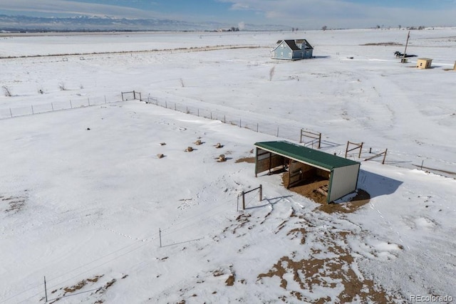 snowy aerial view with a rural view