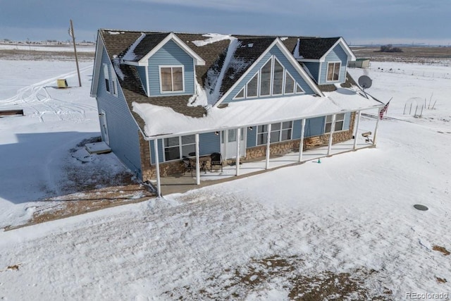 view of snow covered property