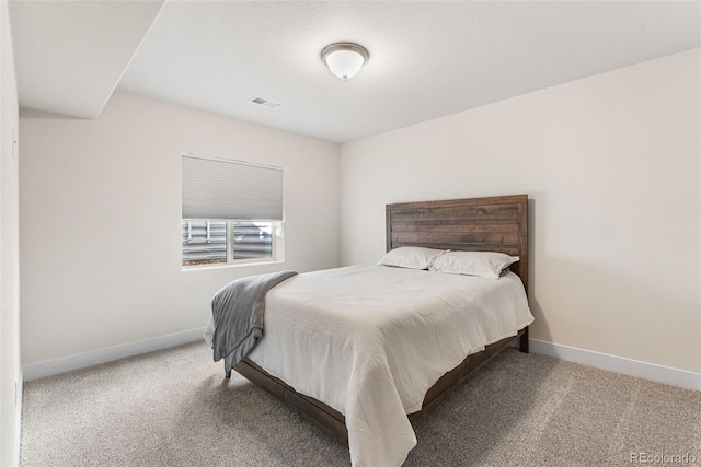 bedroom with baseboards, visible vents, and carpet floors