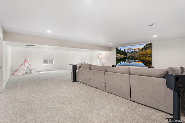 living area featuring carpet flooring, visible vents, baseboards, and recessed lighting