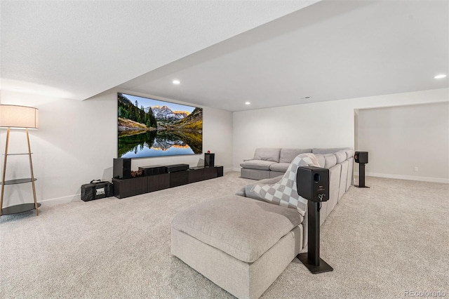 carpeted living area with baseboards and recessed lighting