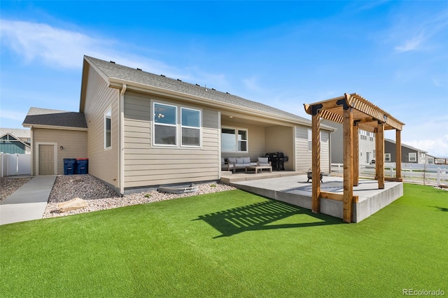 rear view of house with a lawn, a patio area, an outdoor hangout area, and fence