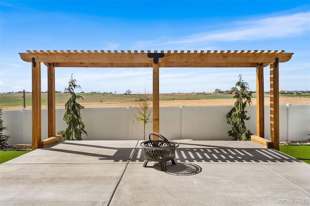 view of patio / terrace featuring a pergola and fence