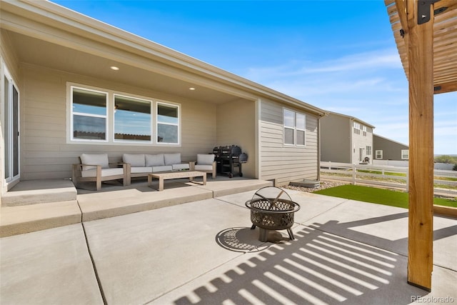 view of patio with an outdoor living space with a fire pit, grilling area, and fence