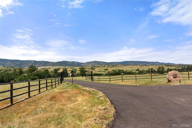 mountain view featuring a rural view