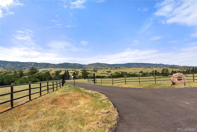 view of road with a mountain view and a rural view