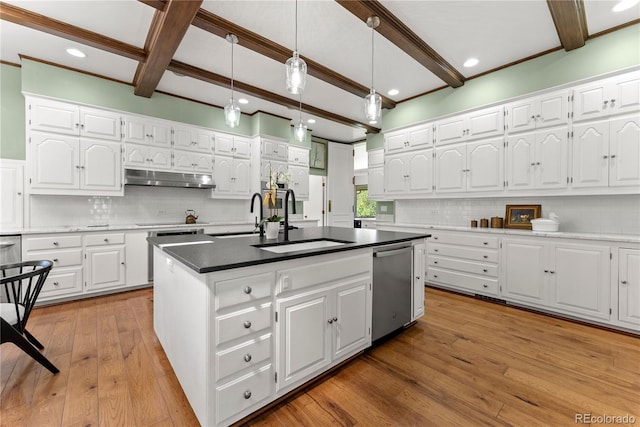 kitchen with light wood-style flooring, a sink, under cabinet range hood, dishwasher, and beamed ceiling