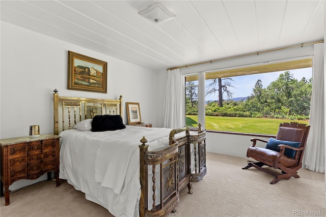 bedroom featuring light colored carpet