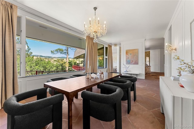 dining room with a chandelier and tile patterned floors