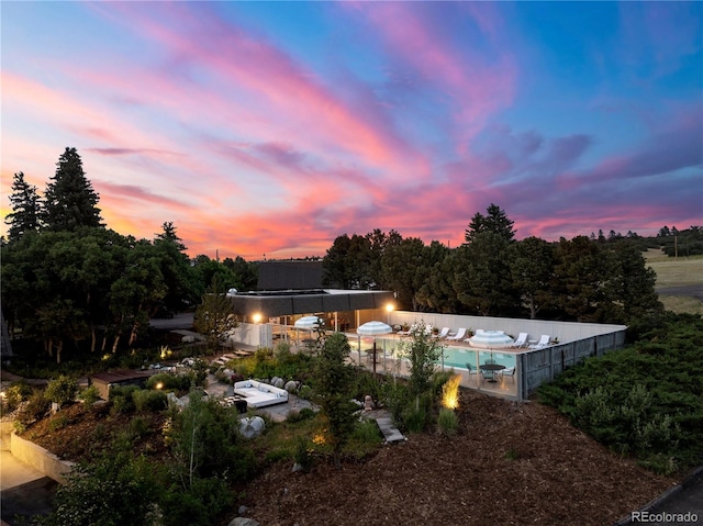 exterior space with a fenced in pool