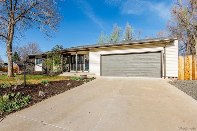 6052 Taft St, Arvada, CO 80004 - ranch-style house with driveway, a garage, and fence