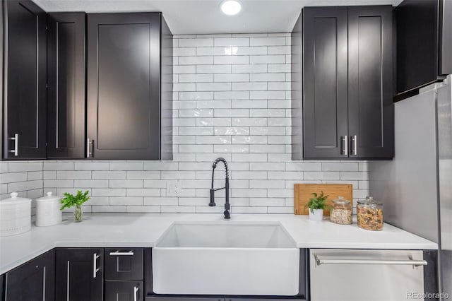6052 Taft St, Arvada, CO 80004 - kitchen featuring a sink, backsplash, light countertops, and dishwasher