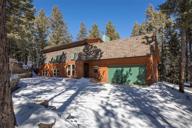 chalet / cabin featuring a garage