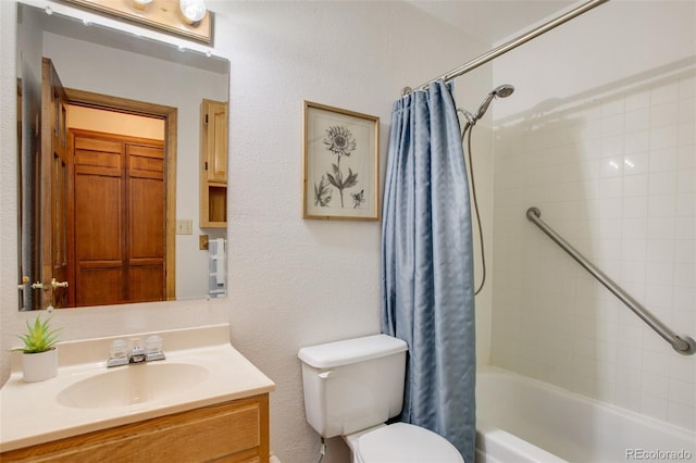 bathroom with shower / tub combo with curtain, toilet, and vanity