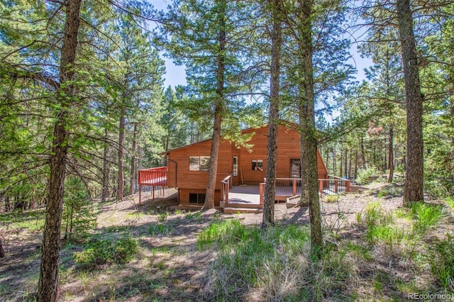 back of property with a wooden deck