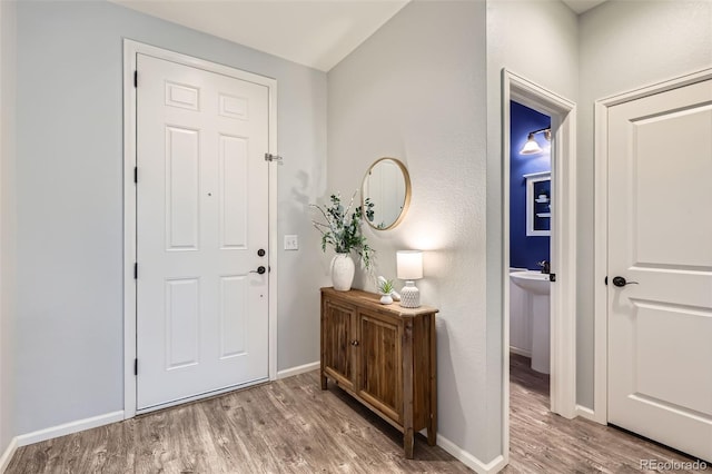 17859 E 108th Pl, Commerce City, CO 80022 - entrance foyer featuring baseboards and wood finished floors