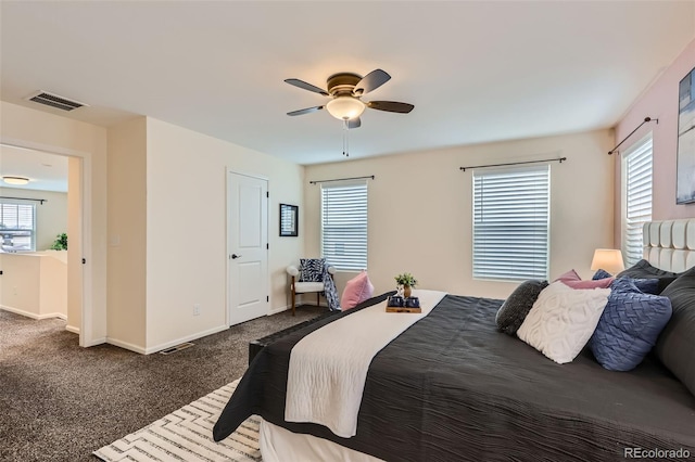 17859 E 108th Pl, Commerce City, CO 80022 - bedroom with dark carpet, baseboards, a ceiling fan, and visible vents