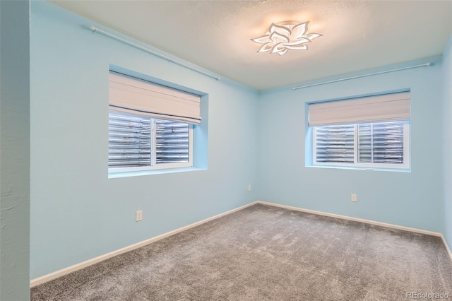 17859 E 108th Pl, Commerce City, CO 80022 - spare room featuring baseboards and carpet