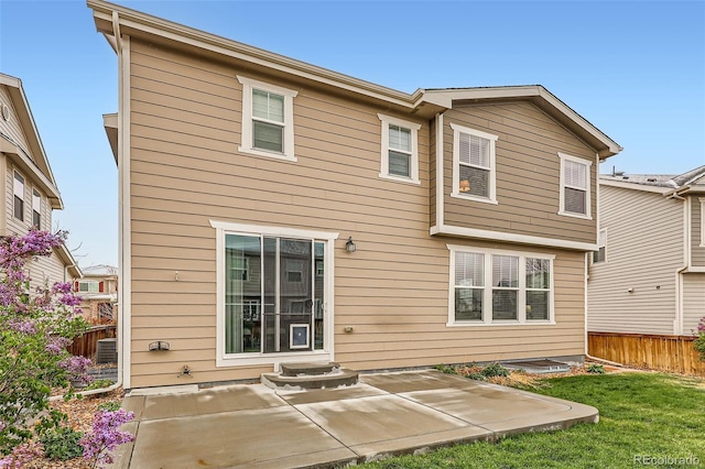 17859 E 108th Pl, Commerce City, CO 80022 - back of property featuring a lawn, central AC, a patio, and fence