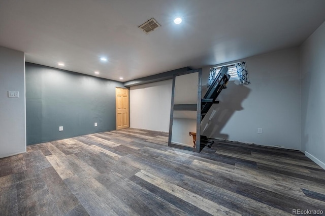 below grade area featuring visible vents, wood finished floors, and recessed lighting