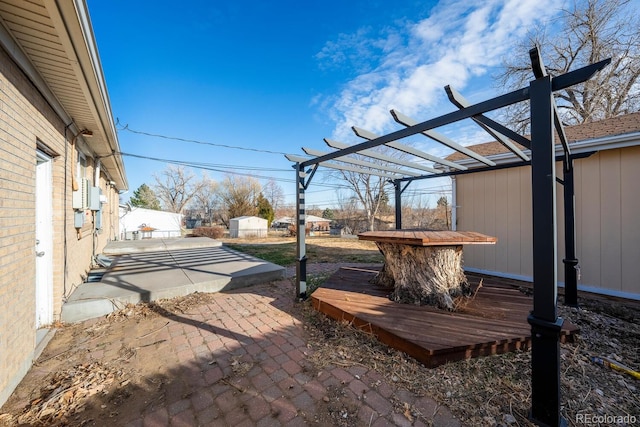 view of yard featuring a deck, a patio, fence, and a pergola