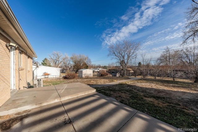 view of yard with a patio and fence