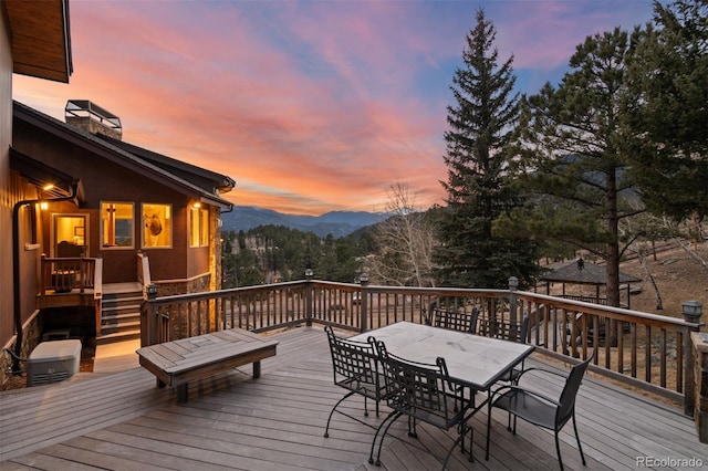 deck at dusk with a mountain view