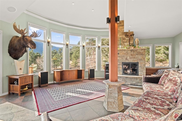 sunroom / solarium featuring a fireplace