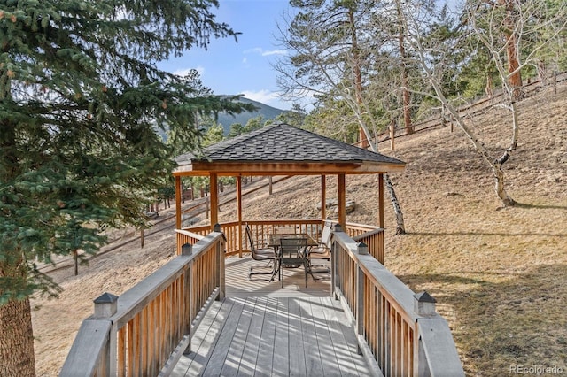 wooden terrace featuring a mountain view