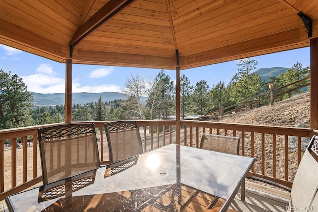 deck with a gazebo and a mountain view