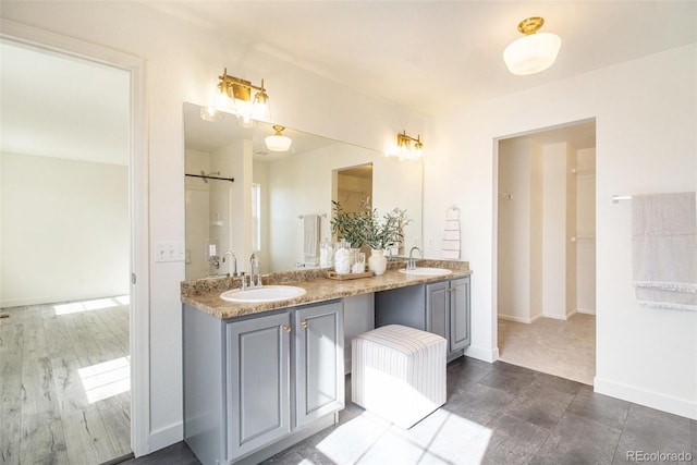 bathroom with vanity and wood-type flooring